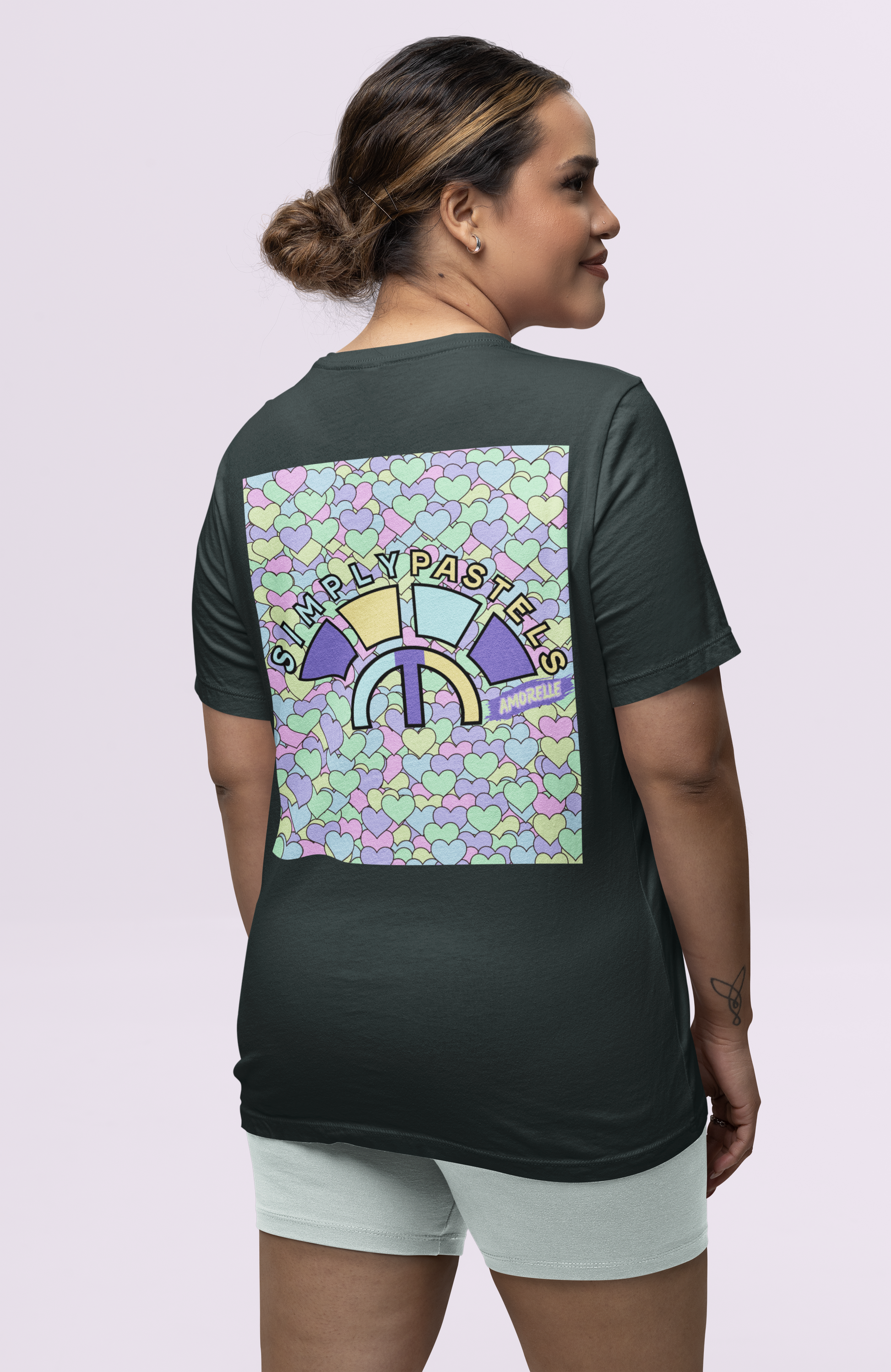Back view of the black Amorelle organic cotton t-shirt with a pastel graphic design, from Simply Pastels, a UK-based premium ethical clothing brand.