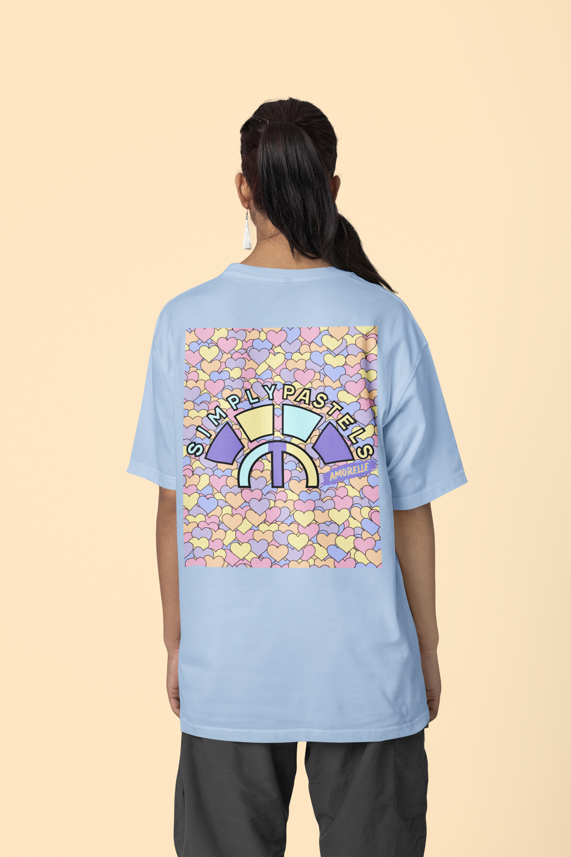 Back view of the blue Amorelle organic cotton t-shirt with a pastel graphic design, from Simply Pastels, a UK-based premium ethical clothing brand.