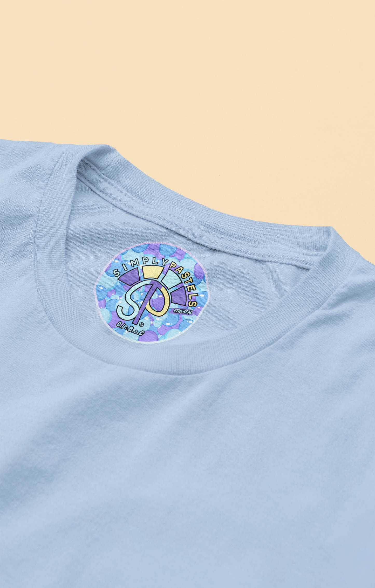 Label view of the blue soul Ethereal organic cotton t-shirt with a pastel graphic design, from Simply Pastels, a UK-based premium ethical clothing brand.