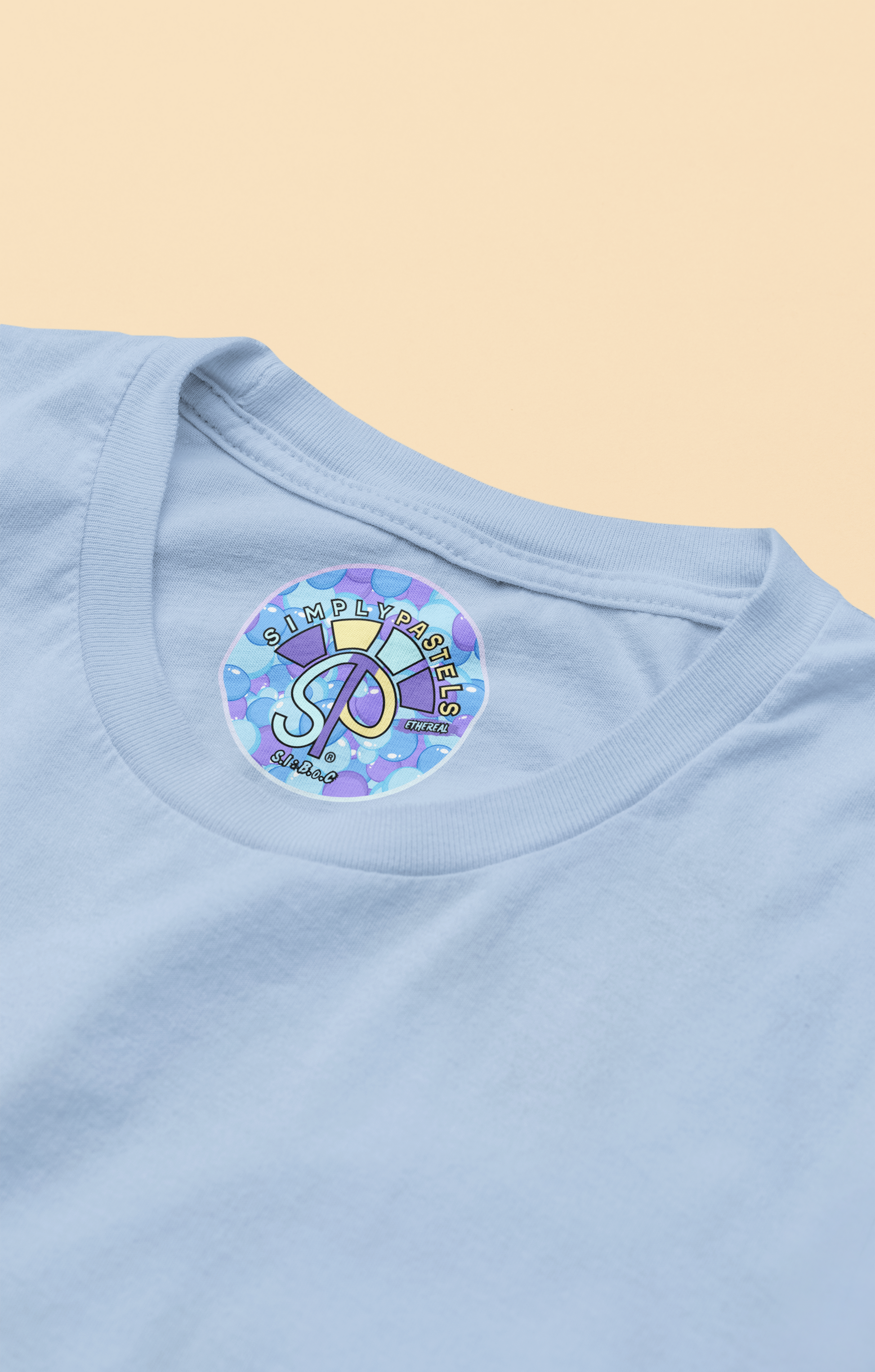 Label view of the blue soul Ethereal organic cotton t-shirt with a pastel graphic design, from Simply Pastels, a UK-based premium ethical clothing brand.