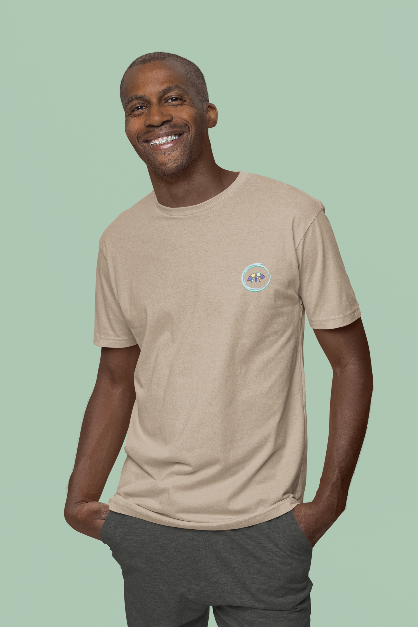 Front view of the desert dust Avid Aspiration  organic cotton t-shirt with a pastel graphic design, from Simply Pastels, a UK-based premium ethical clothing brand.