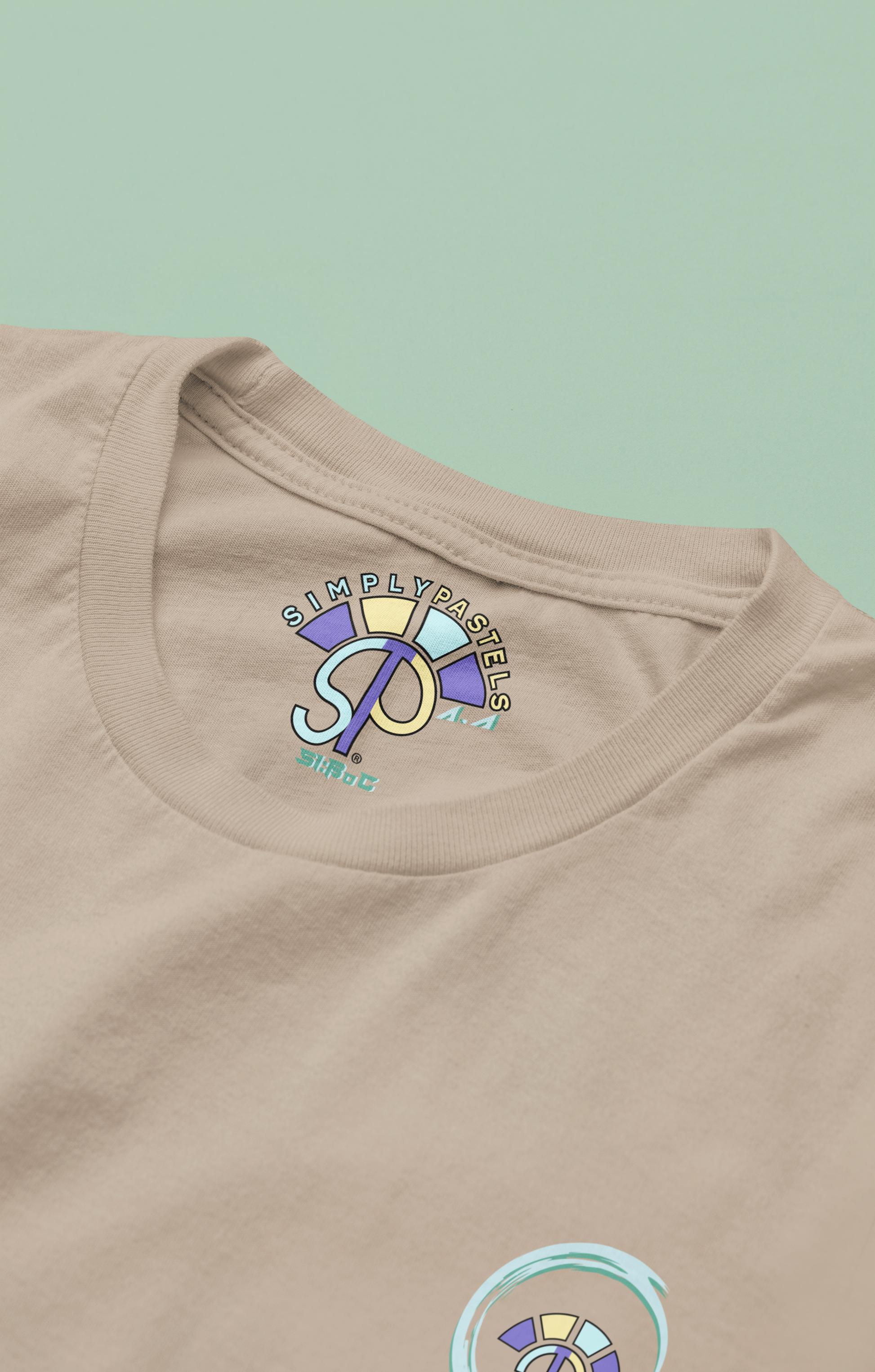 Label view of the desert dust Avid Aspiration  organic cotton t-shirt with a pastel graphic design, from Simply Pastels, a UK-based premium ethical clothing brand.