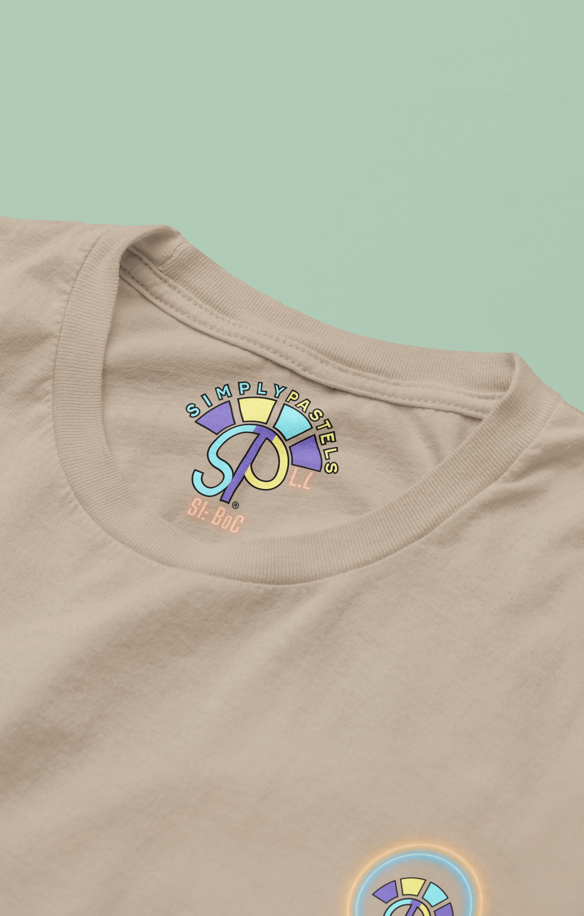 Label view of the desert dust Limitless Levels organic cotton t-shirt with a pastel graphic design, from Simply Pastels, a UK-based premium ethical clothing brand.