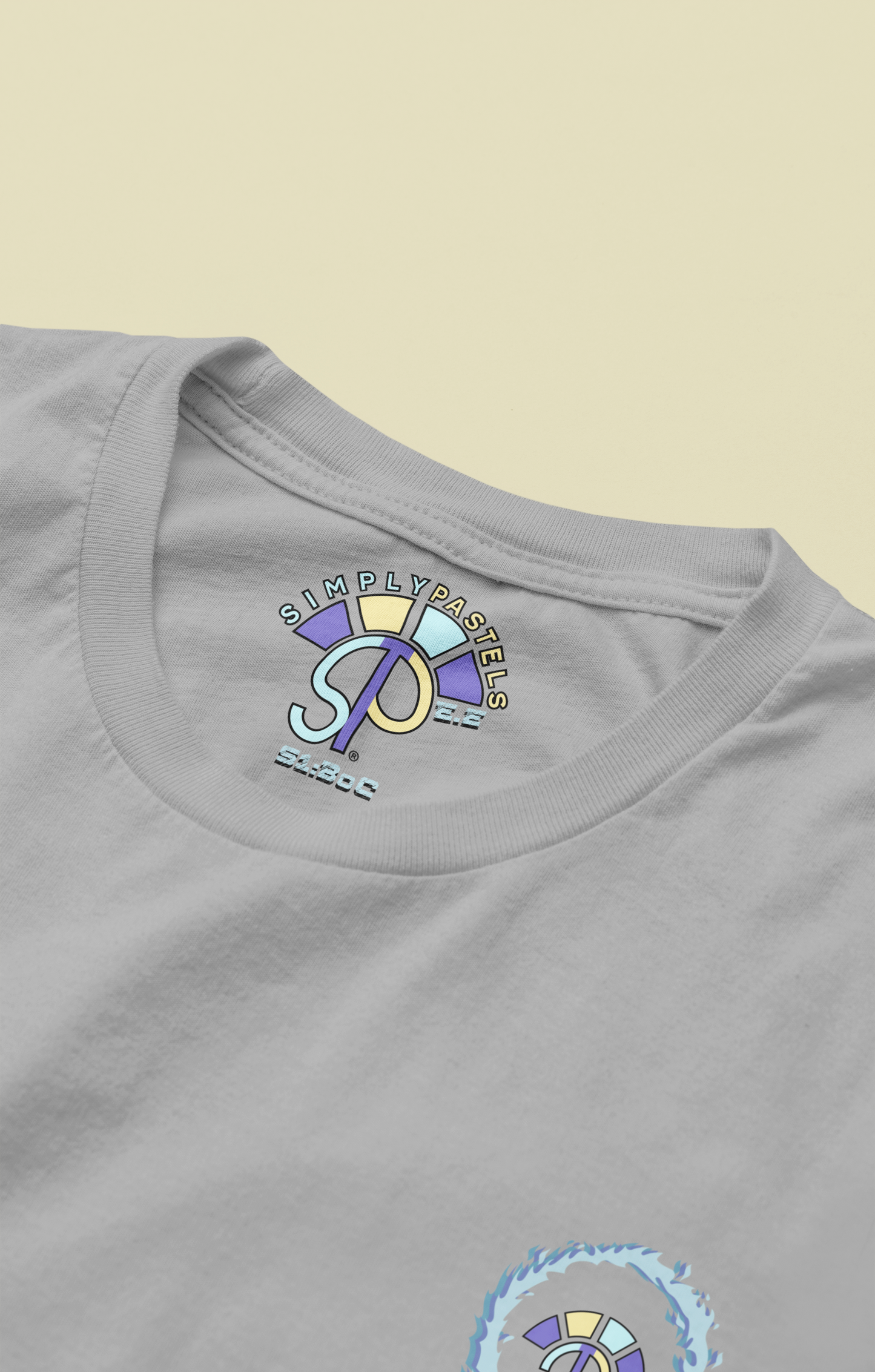 Label view of the heather grey Eternal Essence organic cotton t-shirt with a pastel graphic design, from Simply Pastels, a UK-based premium ethical clothing brand.
