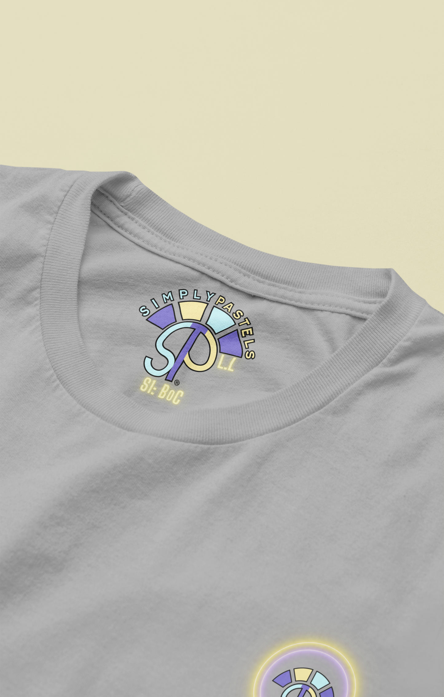 Label view of the heather grey Limitless Levels organic cotton t-shirt with a pastel graphic design, from Simply Pastels, a UK-based premium ethical clothing brand.