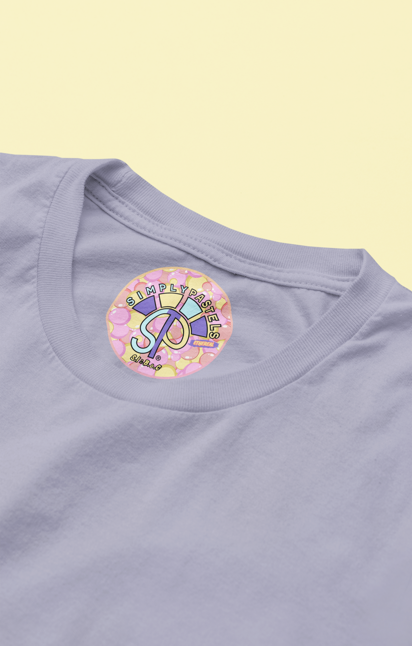 Label view of the lavender Ethereal organic cotton t-shirt with a pastel graphic design, from Simply Pastels, a UK-based premium ethical clothing brand.