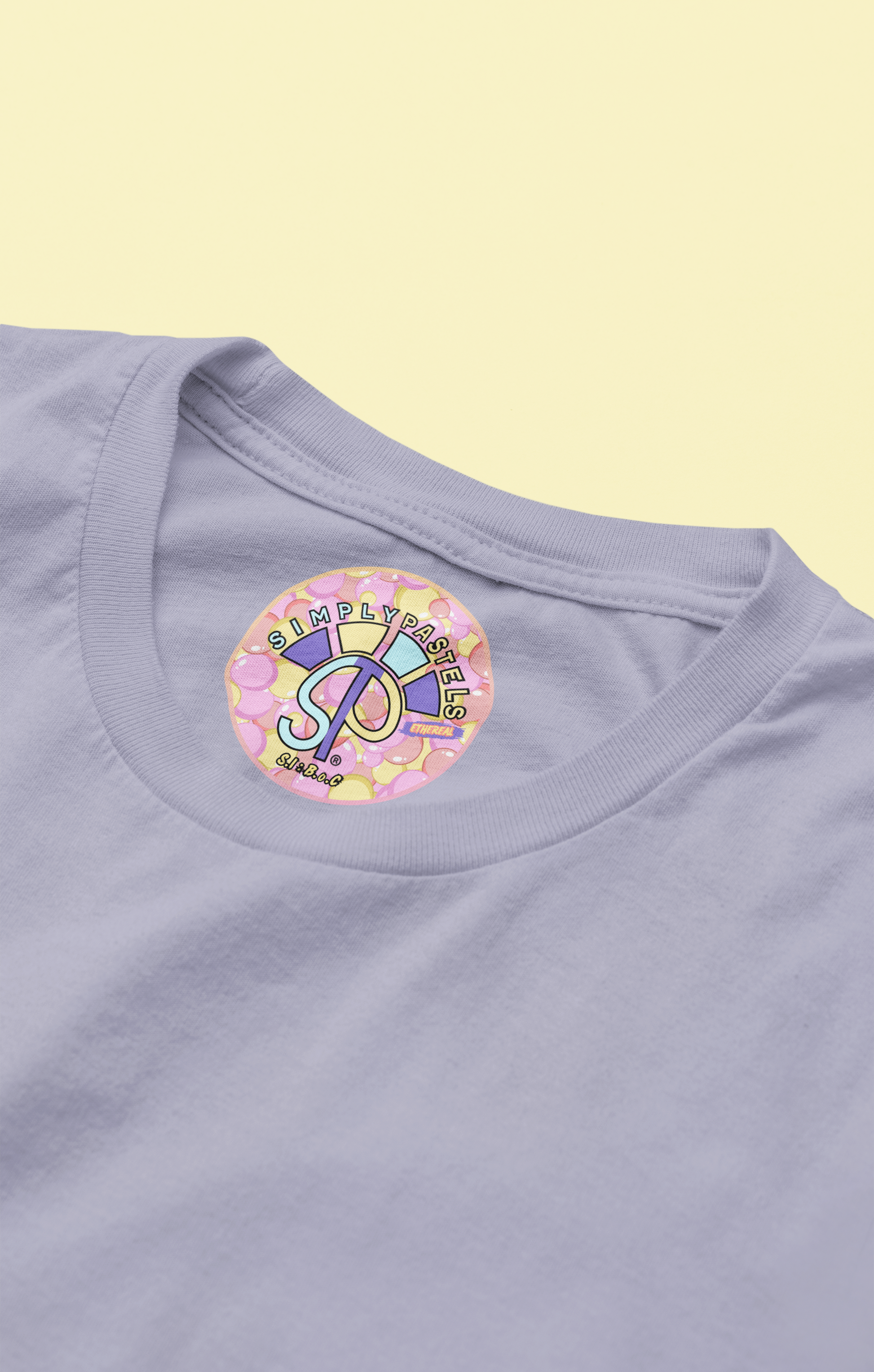 Label view of the lavender Ethereal organic cotton t-shirt with a pastel graphic design, from Simply Pastels, a UK-based premium ethical clothing brand.