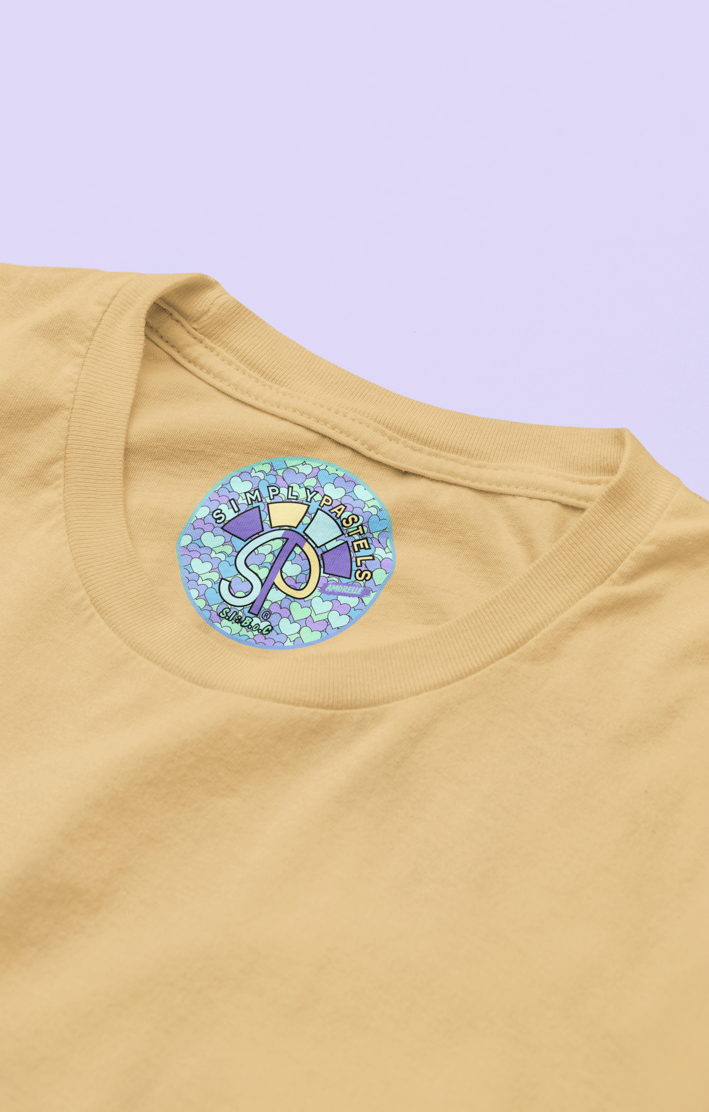 Label view of the nispero Amorelle organic cotton t-shirt with a pastel graphic design, from Simply Pastels, a UK-based premium ethical clothing brand.