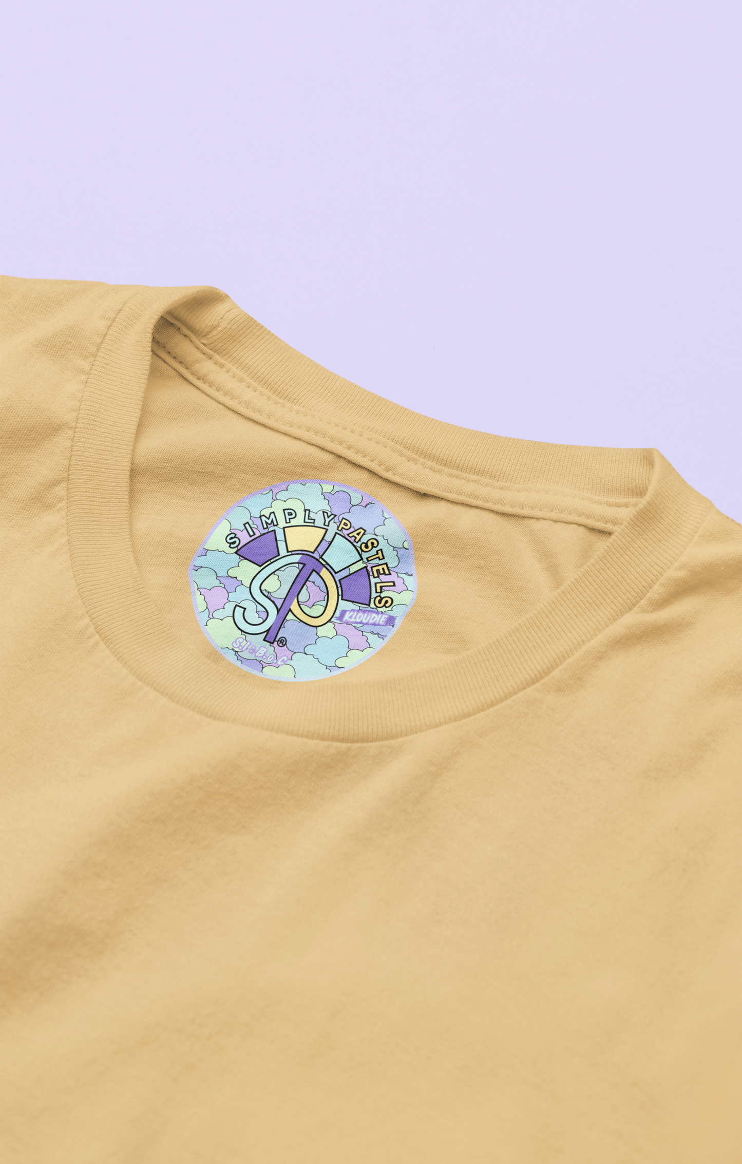 Label view of the nispero Kloudie organic cotton t-shirt with a pastel graphic design, from Simply Pastels, a UK-based premium ethical clothing brand.