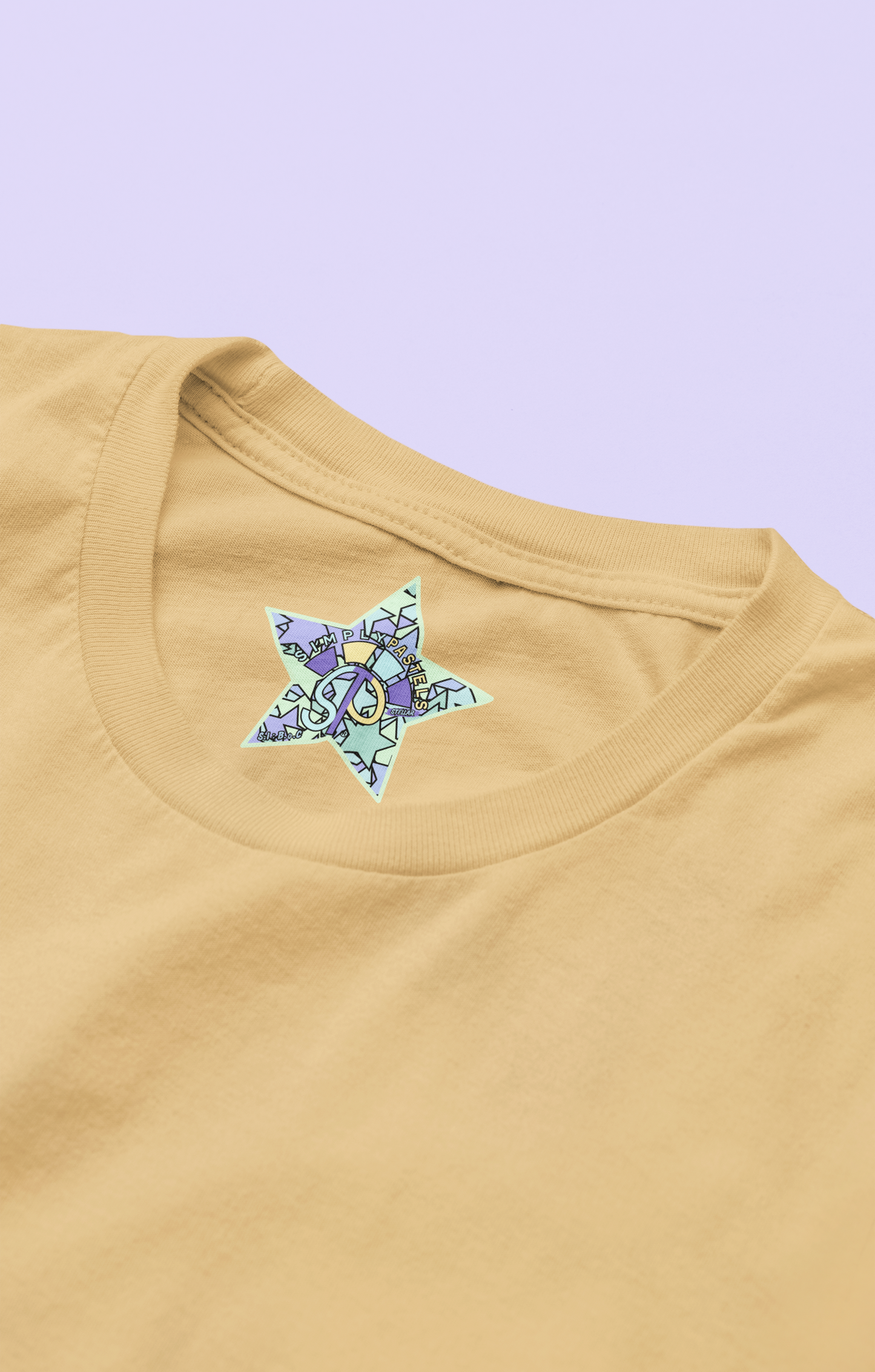 Label view of the nispero Stellar organic cotton t-shirt with a pastel graphic design, from Simply Pastels, a UK-based premium ethical clothing brand.