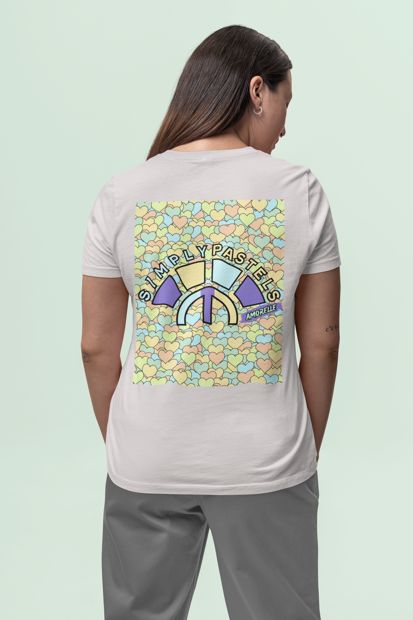 Back view of the off-white Amorelle organic cotton t-shirt with a pastel graphic design, from Simply Pastels, a UK-based premium ethical clothing brand.