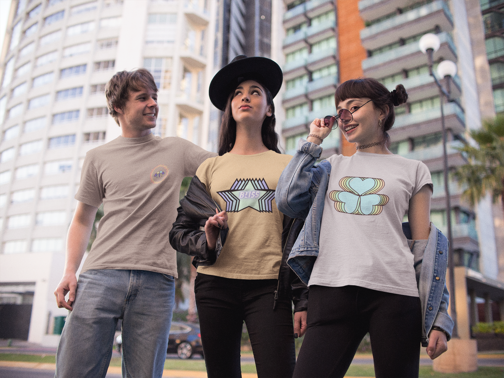 Front view of Simply Pastels Season 1:BoC Desert Dust Eternal Essence, Nispero Stellar, and Off-White Amorelle pastel graphic design t-shirt, featuring three young friends in the middle of the city.