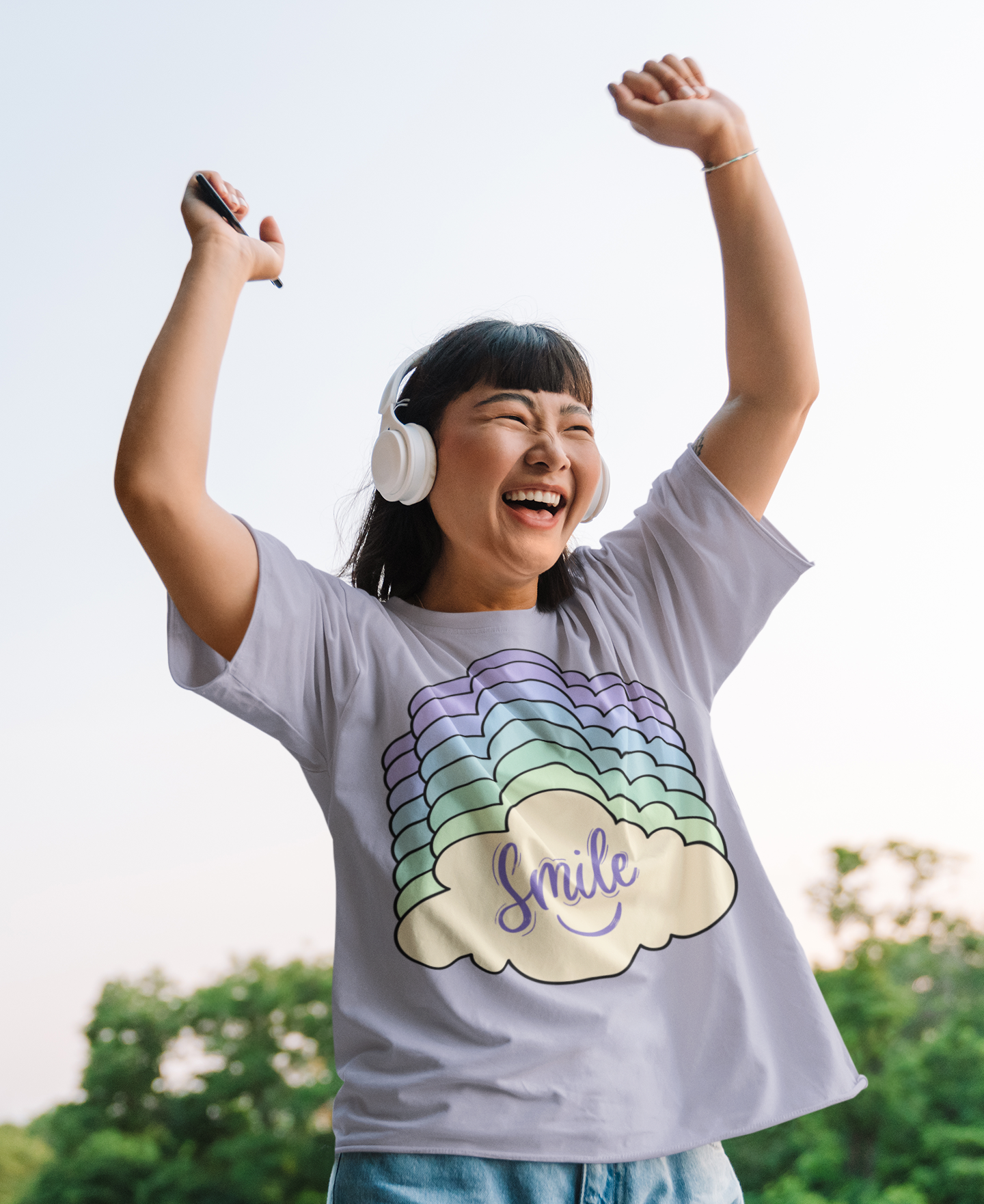 Front view of Simply Pastels Season 1:BoC Lavender Kloudie pastel graphic design t-shirt, featuring a happy women listening to music.