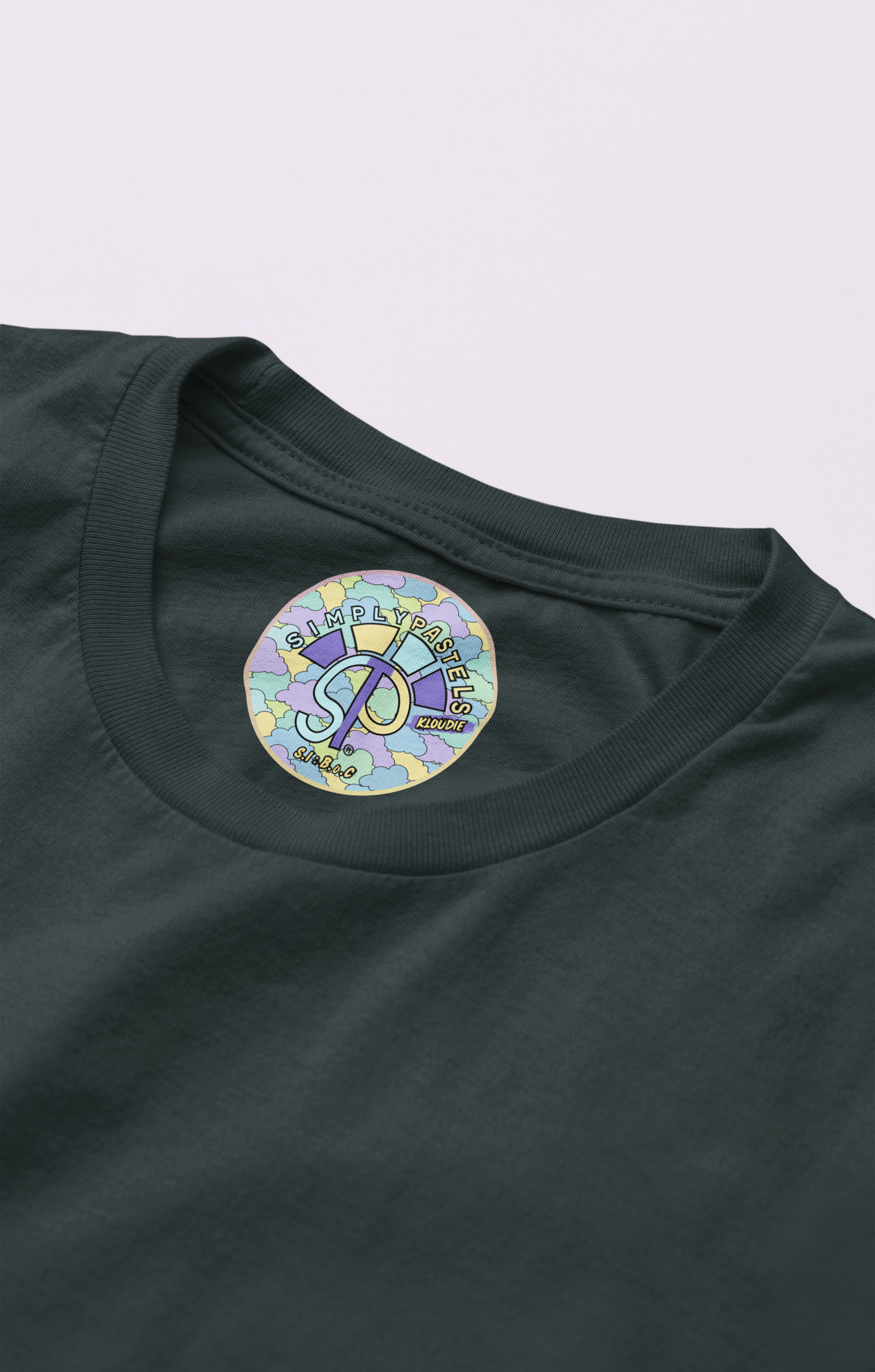 Label view of the black Kloudie organic cotton t-shirt with a pastel graphic design, from Simply Pastels, a UK-based premium ethical clothing brand.
