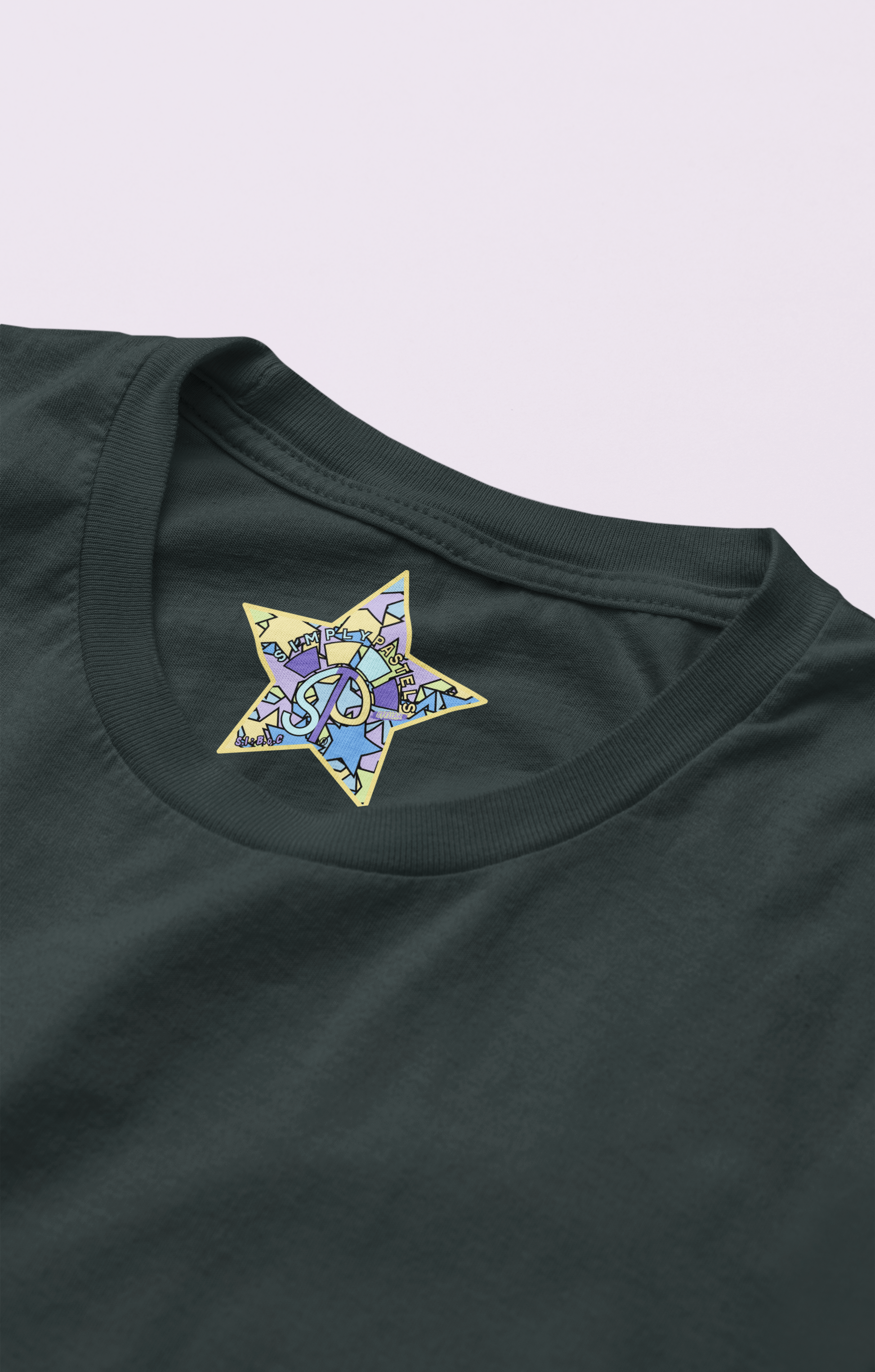 Label view of the black Limitless Levels cotton t-shirt with a pastel graphic design, from Simply Pastels, a UK-based premium ethical clothing brand.
