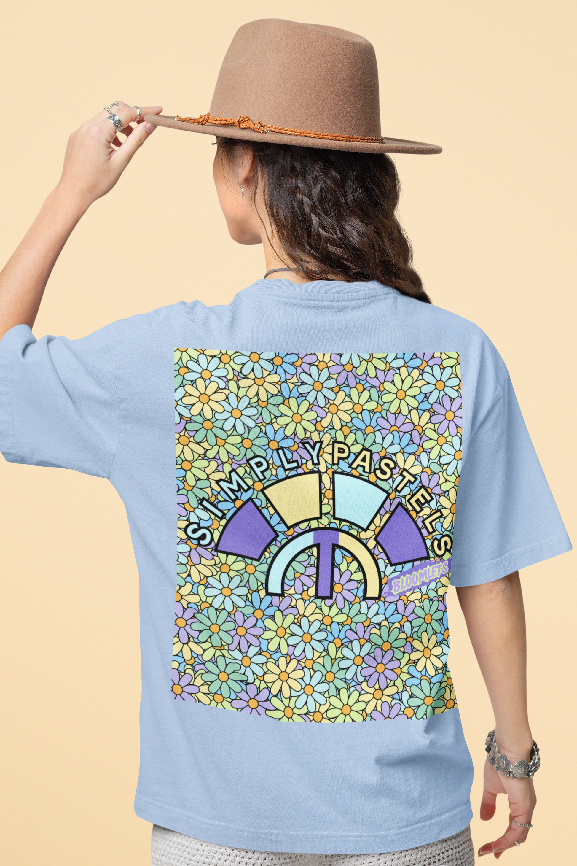 Back view of the blue Bloomlets organic cotton t-shirt with a pastel graphic design, from Simply Pastels, a UK-based premium ethical clothing brand.