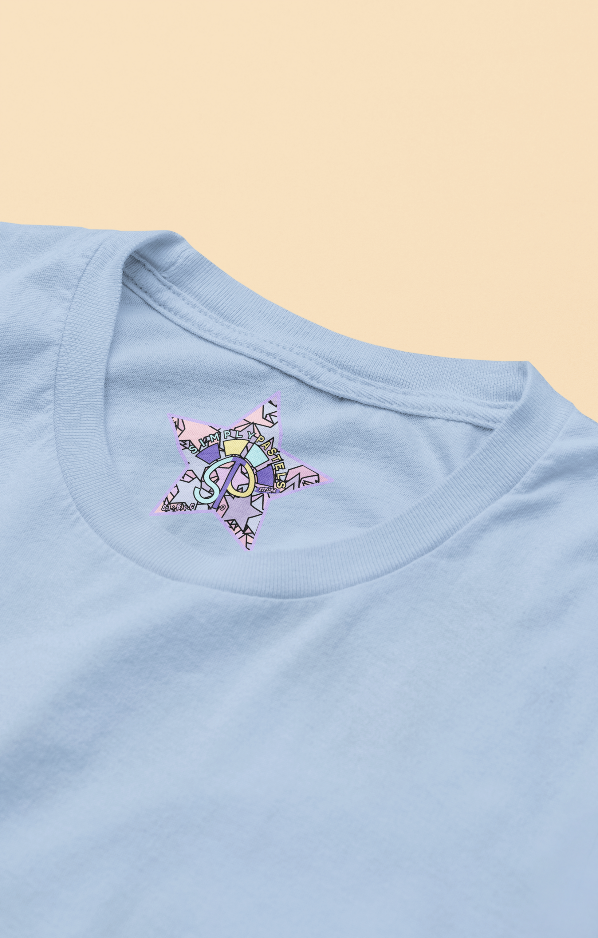 Label view of the blue soul Stellar organic cotton t-shirt with a pastel graphic design, from Simply Pastels, a UK-based premium ethical clothing brand.
