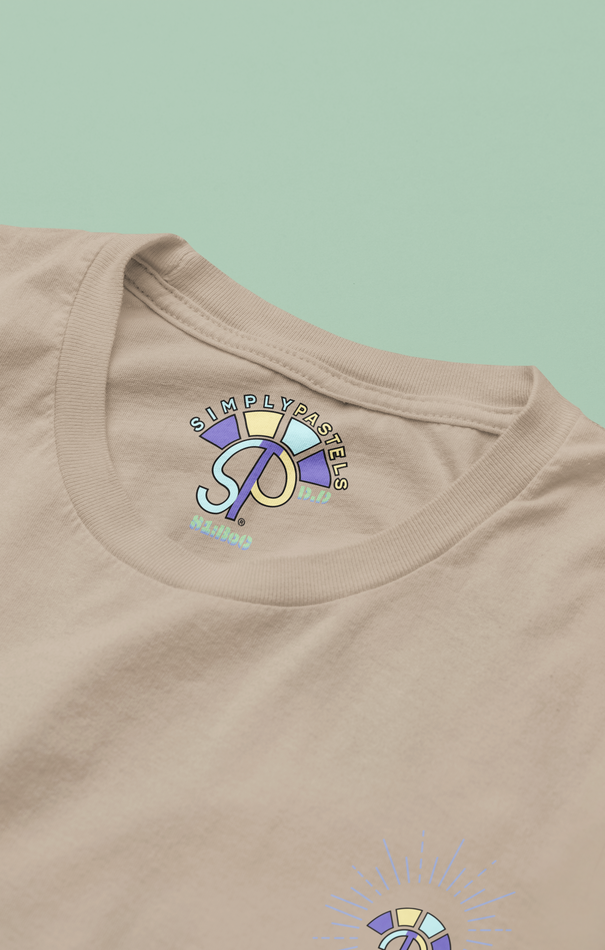 Label view of the desert dust Decisive Determination organic cotton t-shirt with a pastel graphic design, from Simply Pastels, a UK-based premium ethical clothing brand.