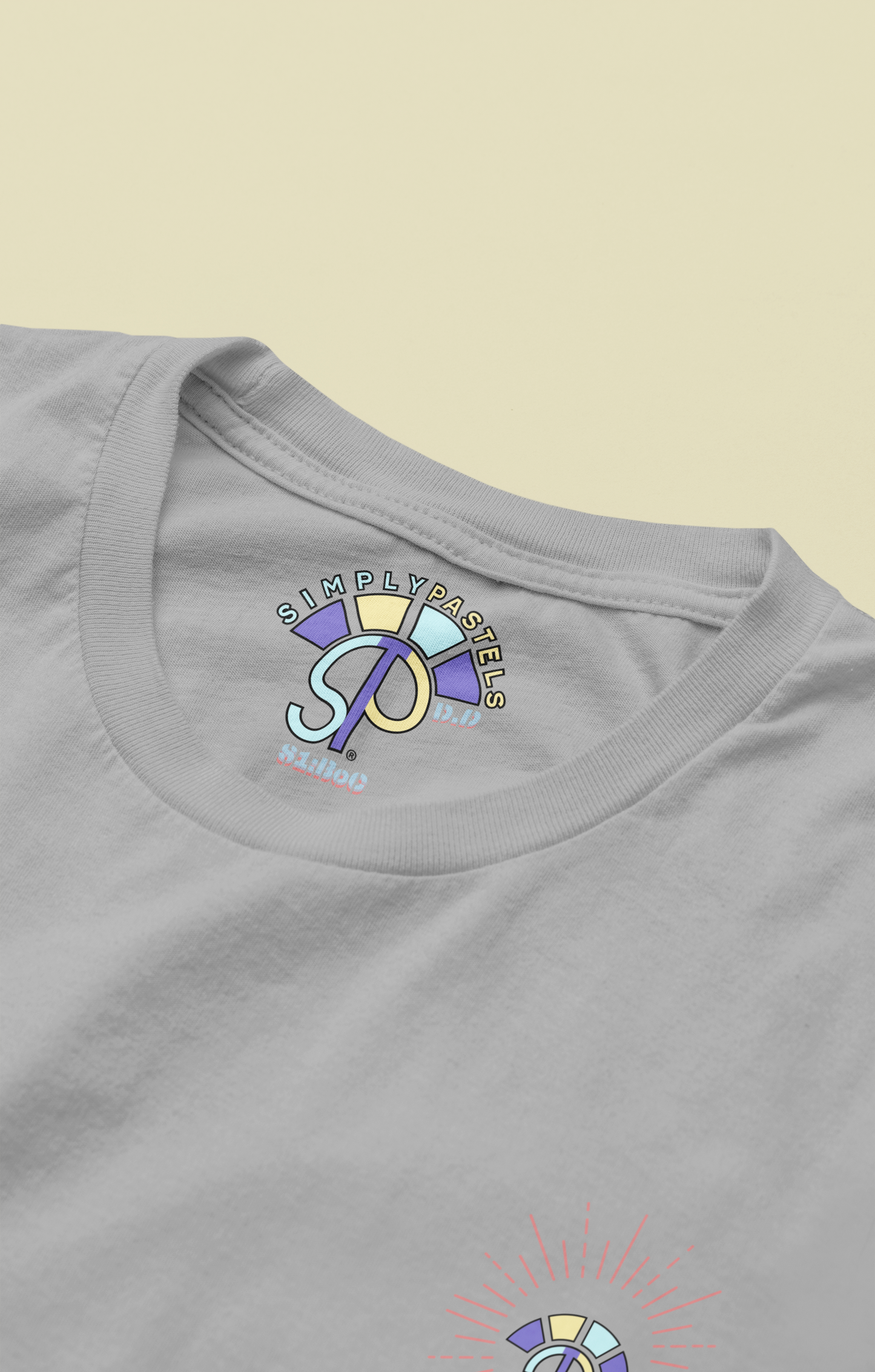 Label view of the heather grey Decisive Determination organic cotton t-shirt with a pastel graphic design, from Simply Pastels, a UK-based premium ethical clothing brand.