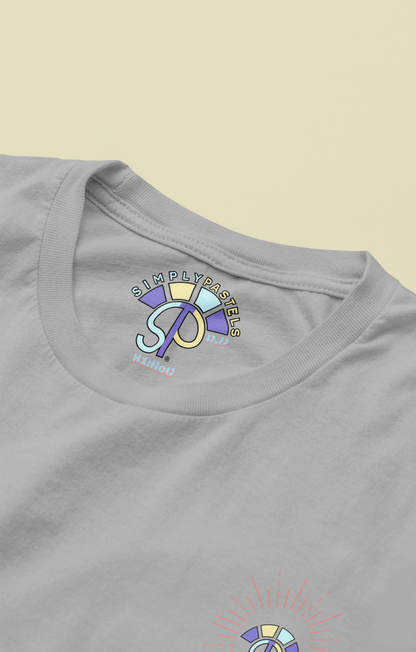 Label view of the heather grey Decisive Determination organic cotton t-shirt with a pastel graphic design, from Simply Pastels, a UK-based premium ethical clothing brand.