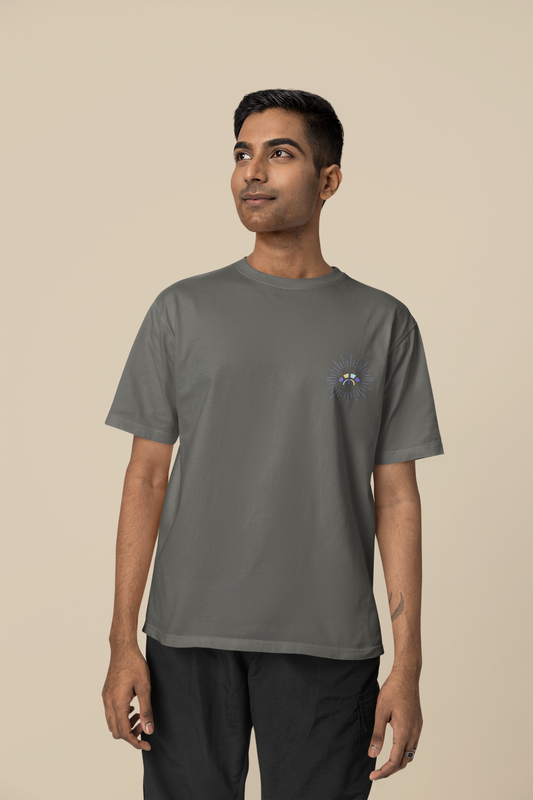 Front view of the khaki Decisive Determination organic cotton t-shirt with a pastel graphic design, from Simply Pastels, a UK-based premium ethical clothing brand.
