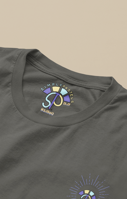 Label view of the khaki Decisive Determination organic cotton t-shirt with a pastel graphic design, from Simply Pastels, a UK-based premium ethical clothing brand.