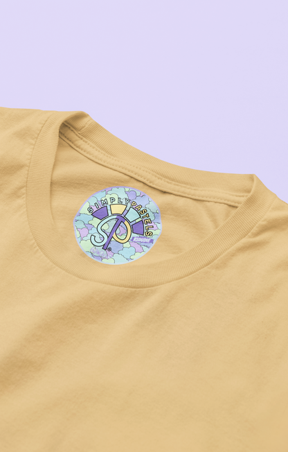Label view of the nispero Kloudie organic cotton t-shirt with a pastel graphic design, from Simply Pastels, a UK-based premium ethical clothing brand.
