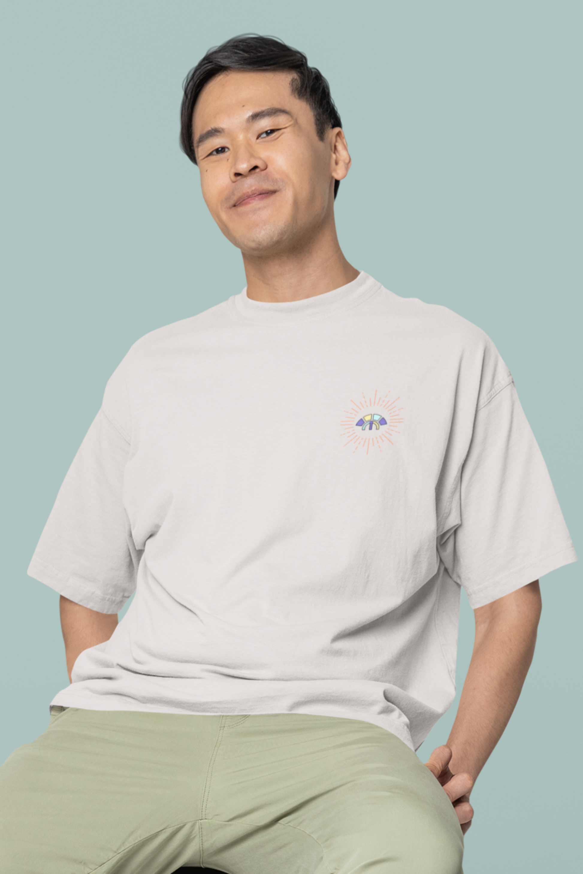Front view of the off-white Decisive Determination organic cotton t-shirt with a pastel graphic design, from Simply Pastels, a UK-based premium ethical clothing brand.