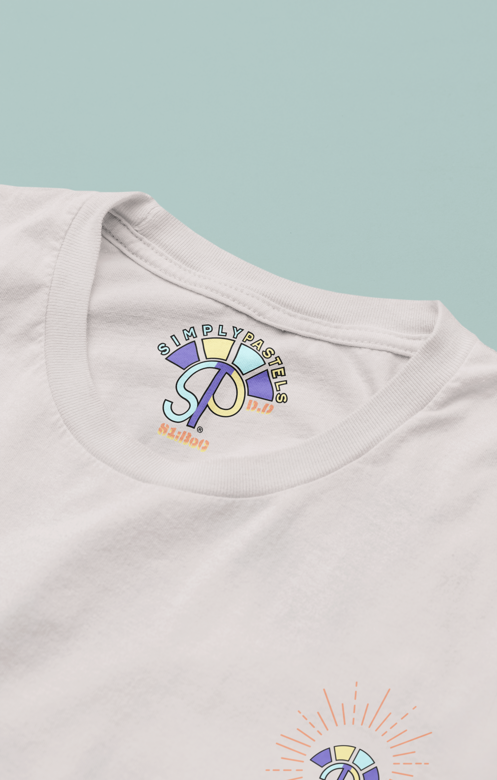 Label view of the off-white Decisive Determination organic cotton t-shirt with a pastel graphic design, from Simply Pastels, a UK-based premium ethical clothing brand.