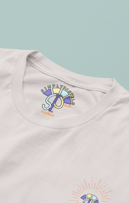 Label view of the off-white Decisive Determination organic cotton t-shirt with a pastel graphic design, from Simply Pastels, a UK-based premium ethical clothing brand.