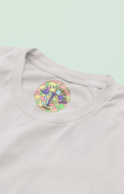 Label view of the off-white Kloudie organic cotton t-shirt with a pastel graphic design, from Simply Pastels, a UK-based premium ethical clothing brand.