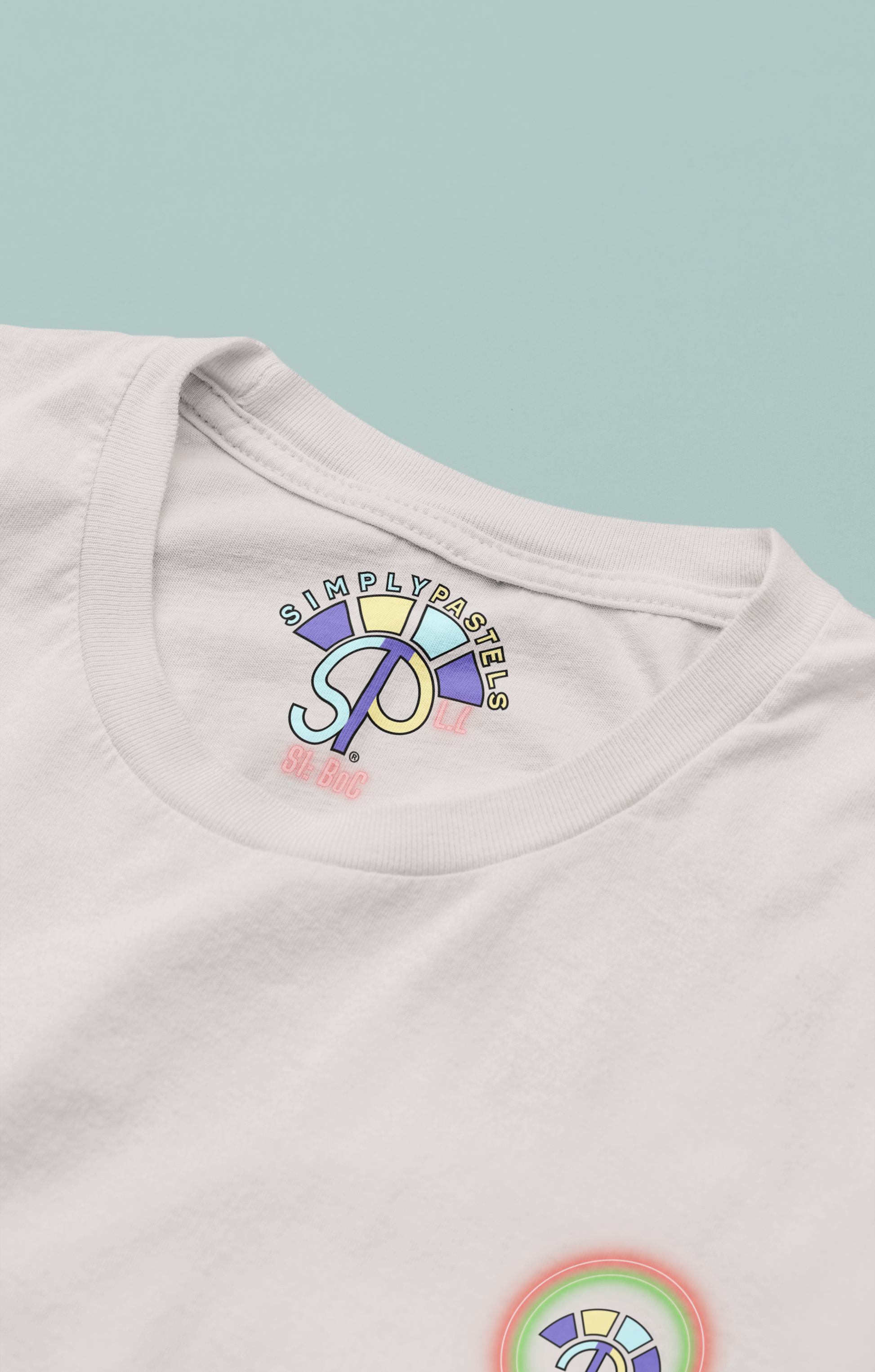 Label view of the off-white Limitless Levels organic cotton t-shirt with a pastel graphic design, from Simply Pastels, a UK-based premium ethical clothing brand.
