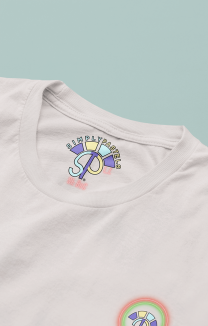 Label view of the off-white Limitless Levels organic cotton t-shirt with a pastel graphic design, from Simply Pastels, a UK-based premium ethical clothing brand.
