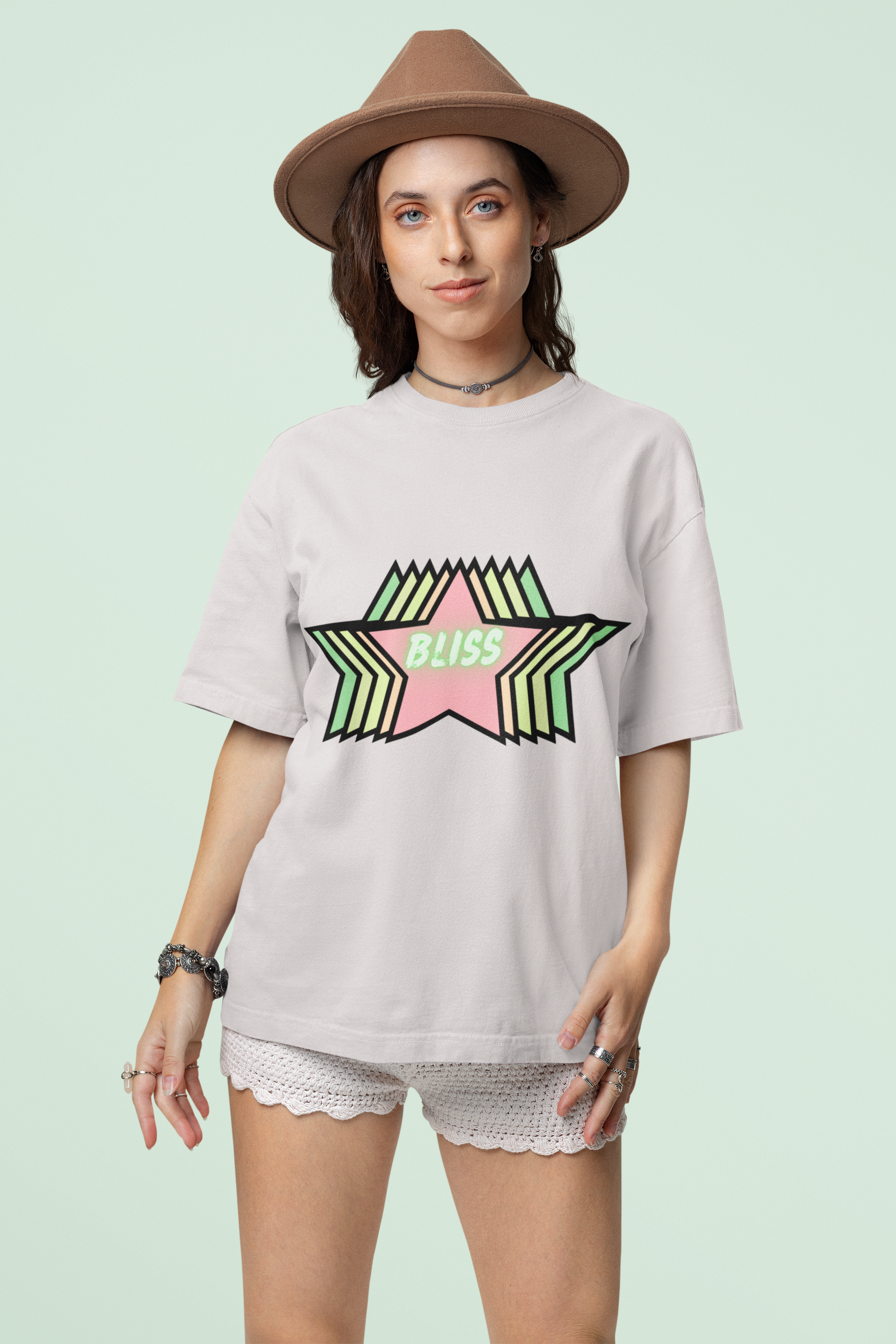 Front view of the off-white Stellar organic cotton t-shirt with a pastel graphic design, from Simply Pastels, a UK-based premium ethical clothing brand.